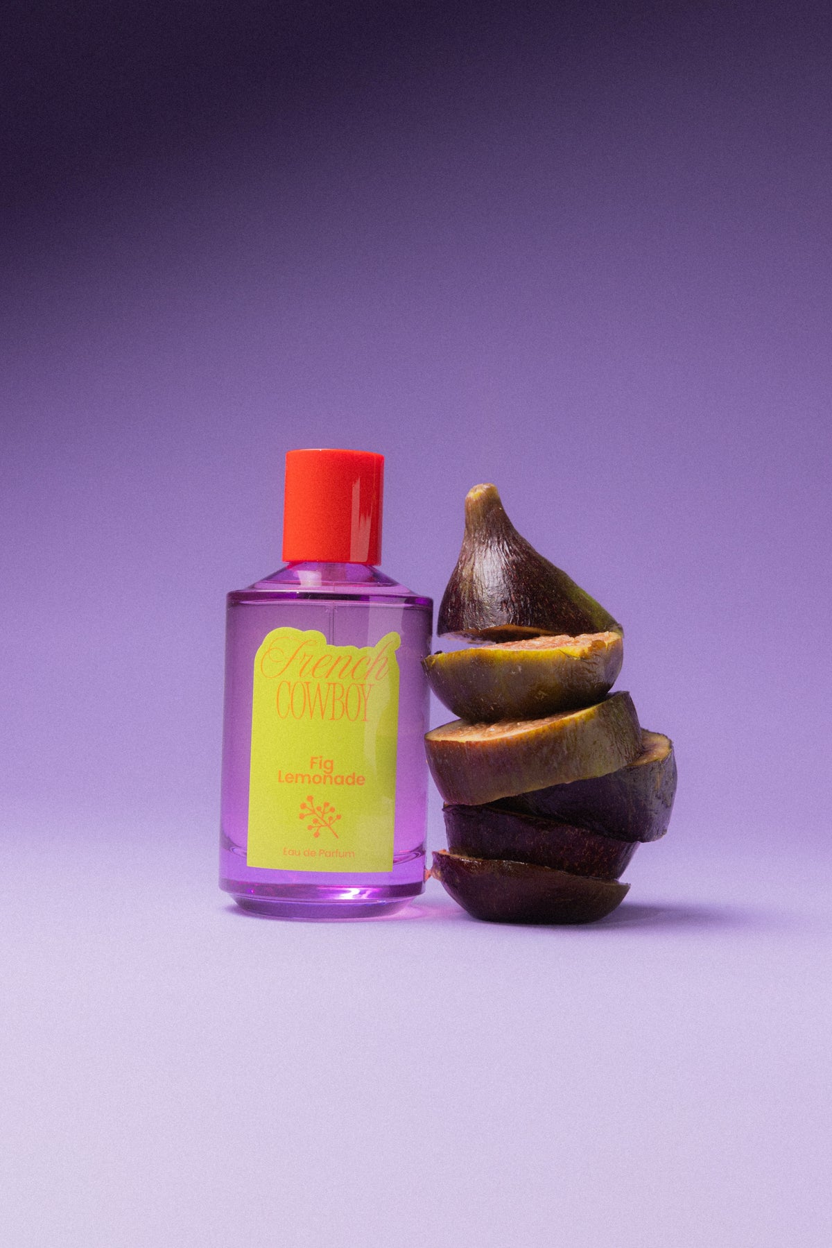 French Cowboy Fig Lemonade bottle beside sliced figs