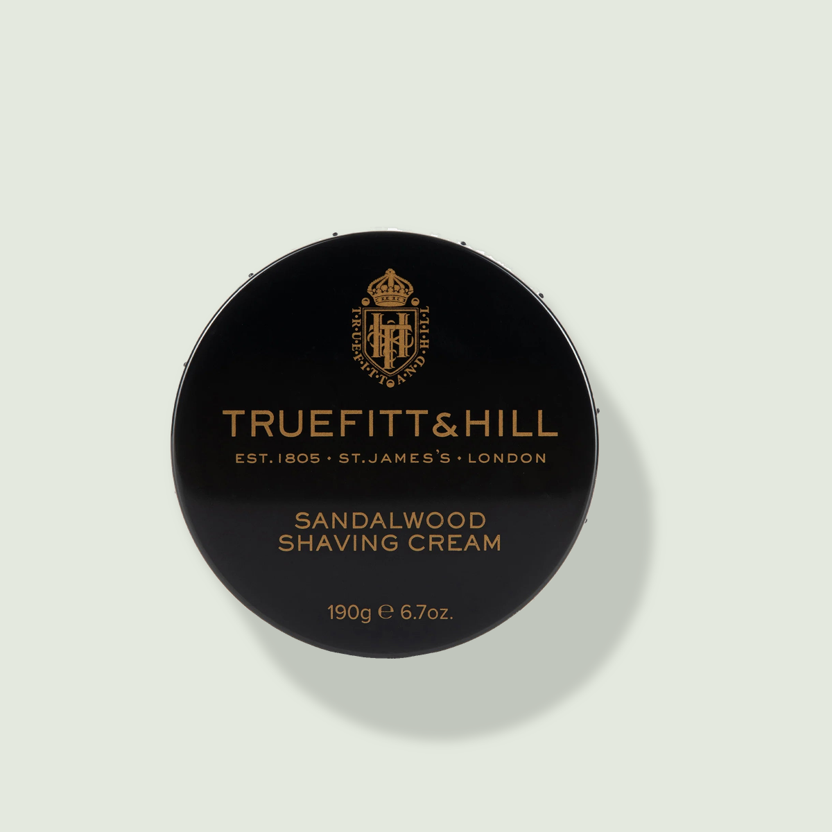 TRUEFITT & HILL Sandalwood Shaving Cream uz salvijas krāsas fona